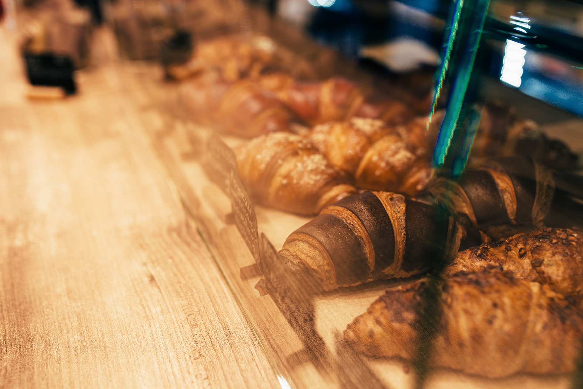 the-waiter-pulls-out-croissants-in-a-cafe-window-2025-03-08-05-35-43-utc