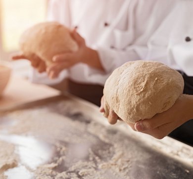 crop-bakers-kneading-soft-dough-2023-11-27-05-24-12-utc